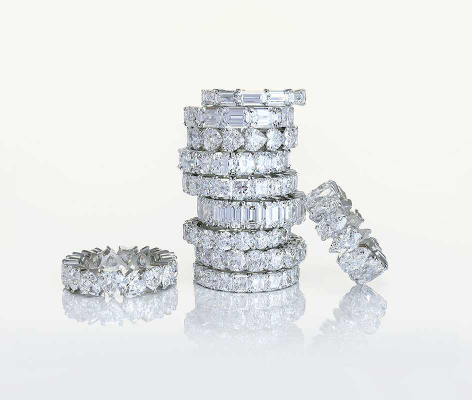 A large stack of diamond fashion rings