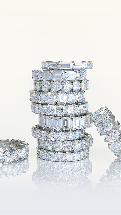 A large stack of diamond fashion rings