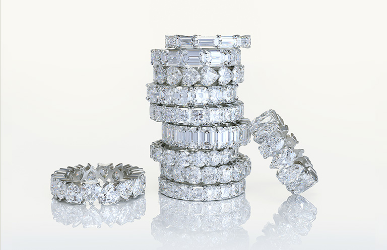 A large stack of diamond fashion rings